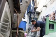 Egyptian worker forced to wash in unhealthy overcrowded locations