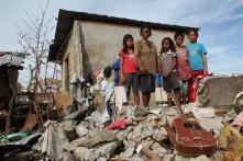 Philippine Family their lives back together after there home was destroyed by typhoon Hayan.