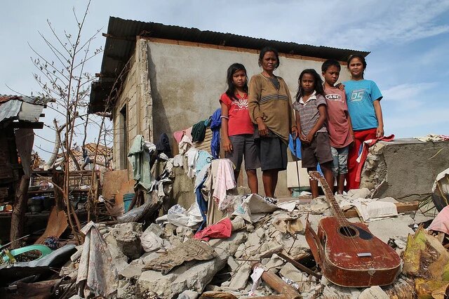 Philippine Family their lives back together after there home was destroyed by typhoon Hayan. Philippine Family their lives back together after there home was destroyed by typhoon Hayan.